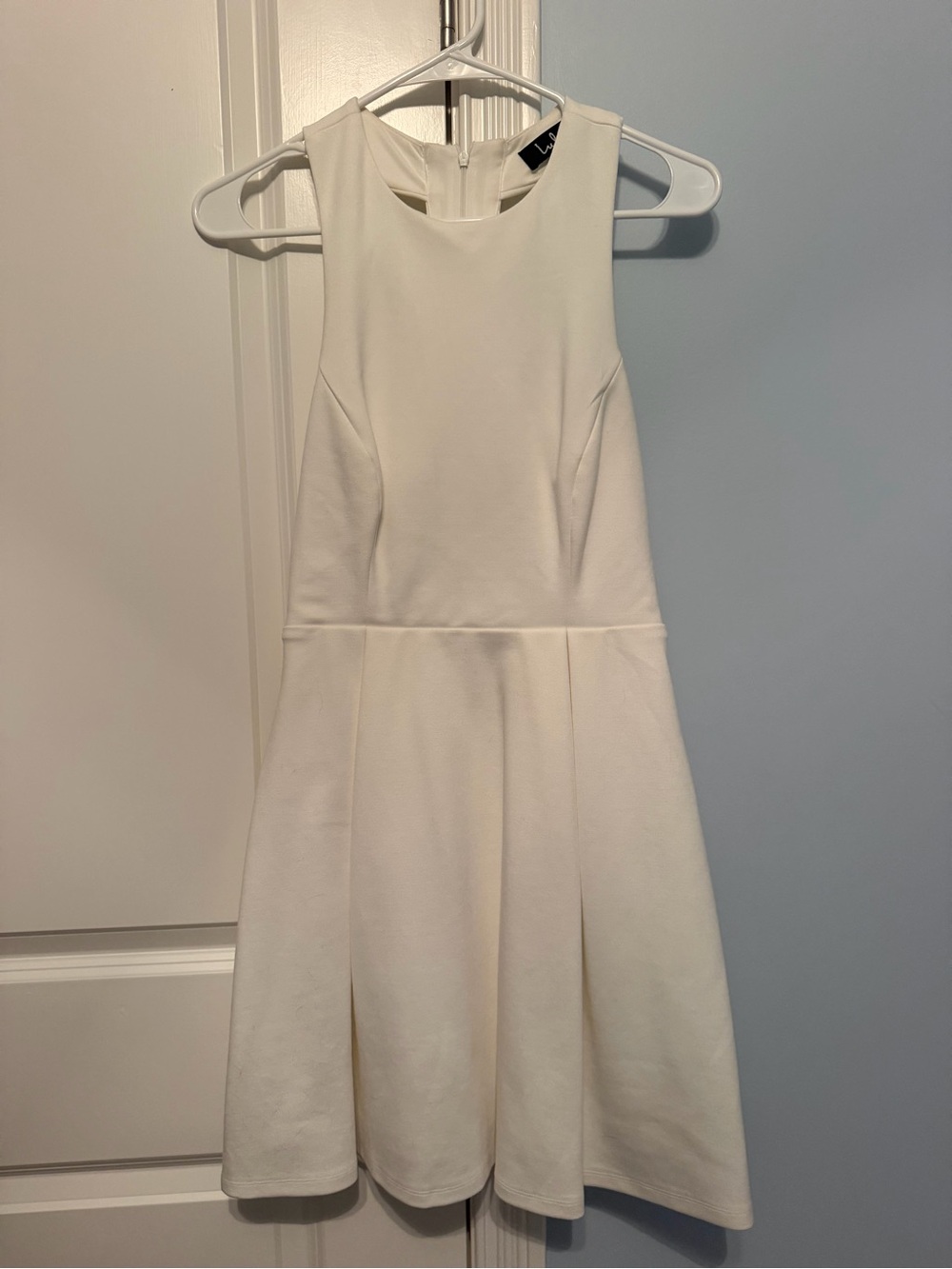 Lulu’s White Sleeveless Fit-and-Flare Dress With Cut Out Back Detail